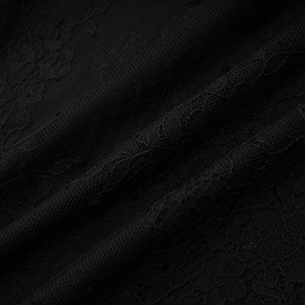 A black maxi dress with crystal embellishments and a crossover design featuring long sleeves and a floor length skirt