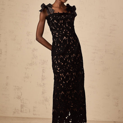 A black maxi dress with floral embroidery details named Eloise