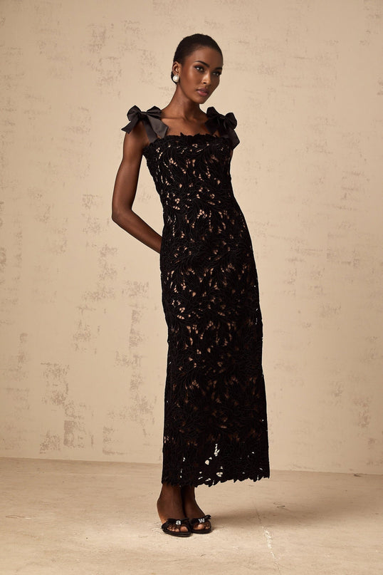 A black maxi dress with floral embroidery details named Eloise