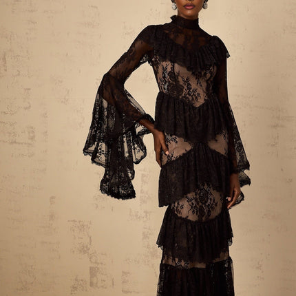 A black maxi dress with floral lace pattern and ruffled details named Roxane
