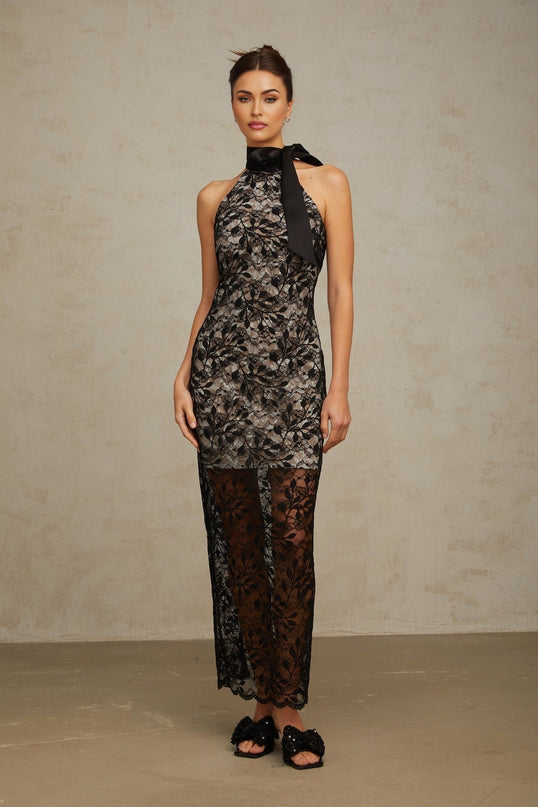 A black maxi dress with floral lace pattern featuring a halter neckline named Coralie