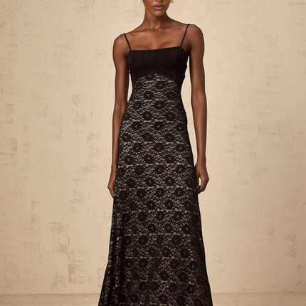 A black maxi dress with floral lace patterns and an open back design named Zelie
