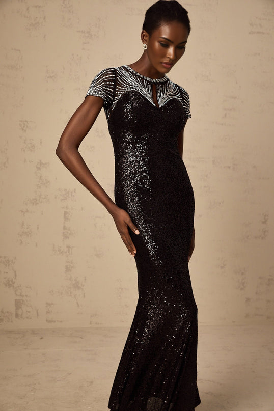A black maxi dress with sequin details and cut out design featuring a long flowing skirt