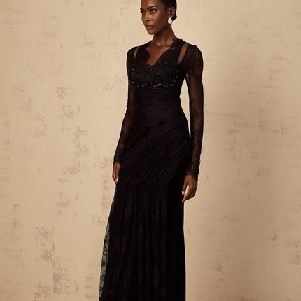 A black mermaid style maxi dress with floral lace pattern featuring a fitted bodice and flared skirt