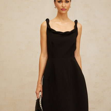 A black midi dress with a braided texture and puff sleeves on a mannequin or model against a plain background