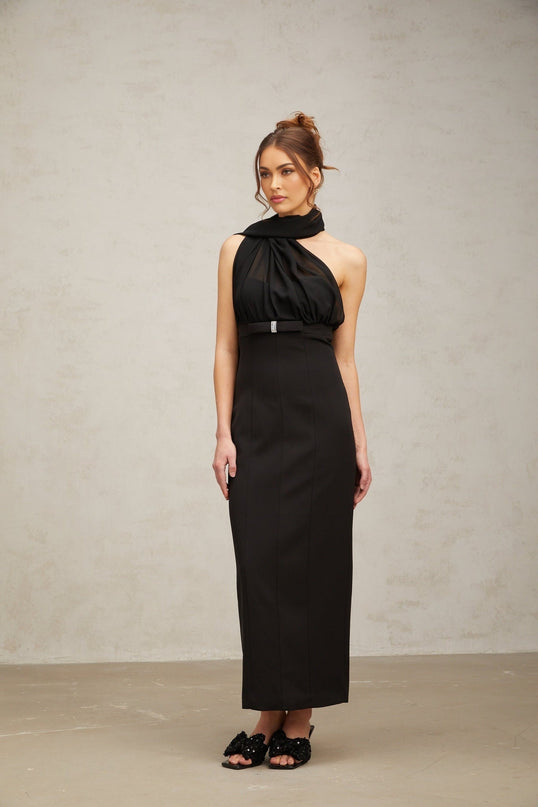 A black midi dress with a single shoulder strap and elegant draped design
