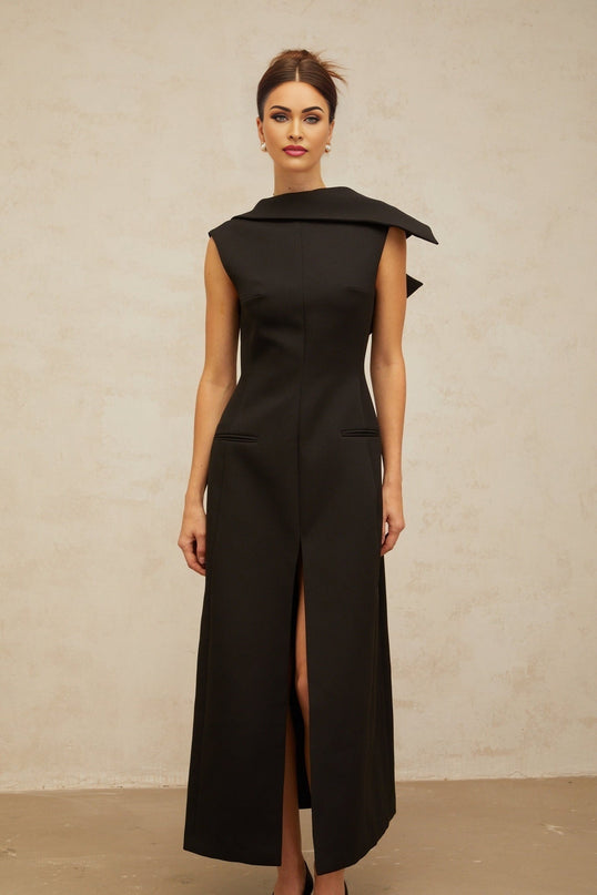 A black midi dress with an open back and deconstructed design named Leonore