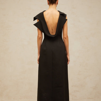 A black midi dress with an open back and deconstructed design named Leonore