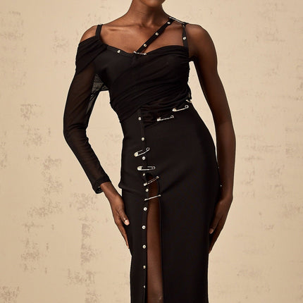 A black midi dress with asymmetric design and cutout details featuring a sleek silhouette and modern style