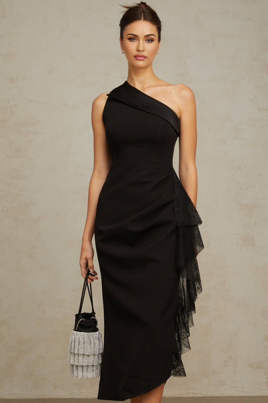 A black midi dress with asymmetric hemline featuring lace panels and a sleek silhouette named Bernadette