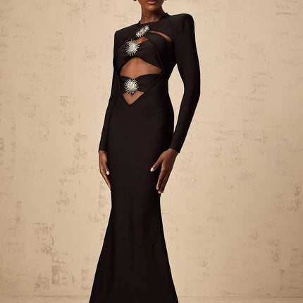 A black midi dress with cutout details featuring a sun motif pattern and ruched fabric Astrid style with a fitted silhouette