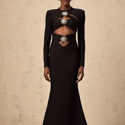 A black midi dress with cutout details featuring a sun motif pattern and ruched fabric Astrid style with a form fitting silhouette