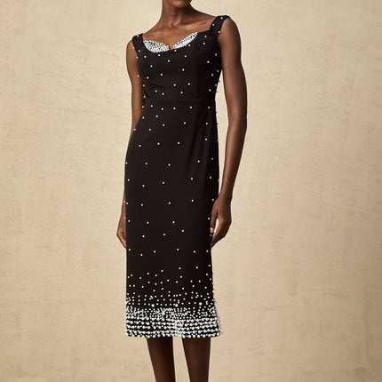 A black midi dress with faux pearl embellishments called Apolline