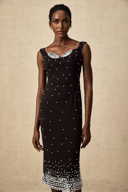 A black midi dress with faux pearl embellishments called Apolline