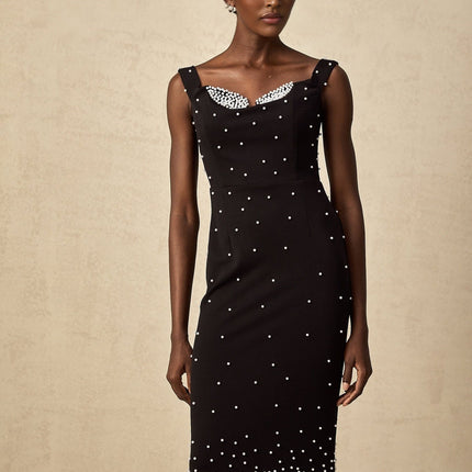 A black midi dress with faux pearl embellishments named Apolline