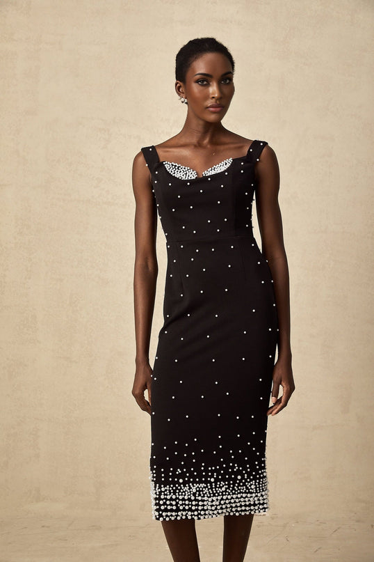 A black midi dress with faux pearl embellishments named Apolline