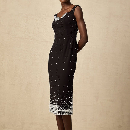 A black midi dress with faux pearl embellishments named Apolline