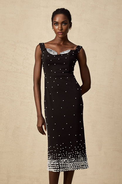A black midi dress with faux pearl embellishments named Apolline