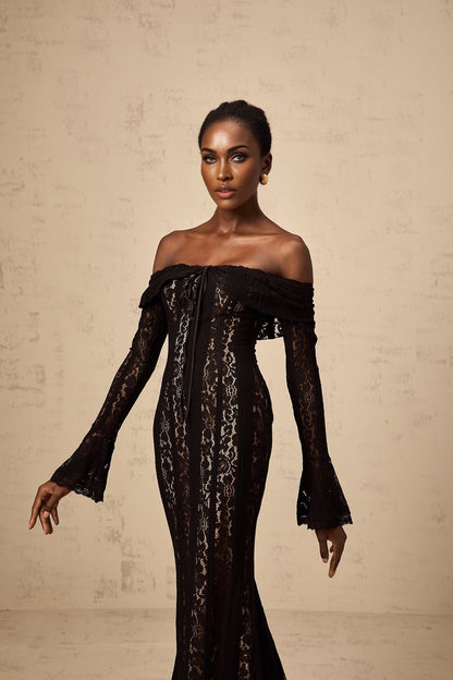 A black midi dress with floral lace detailing and flared cuffs named Émeline