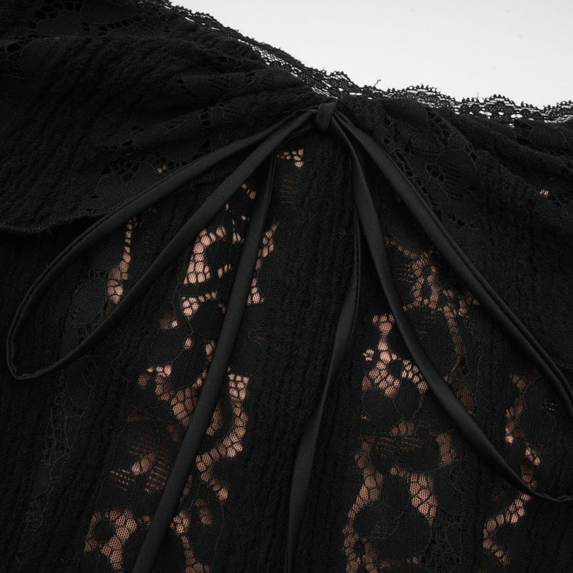 A black midi dress with floral lace detailing and flared cuffs named Émeline