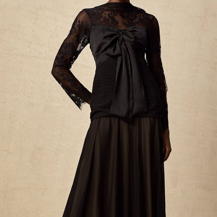 A black midi dress with floral lace panels and a delicate feminine design named Amelie