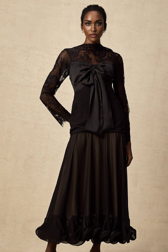 A black midi dress with floral lace panels and a delicate feminine design named Amelie