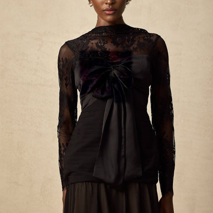 A black midi dress with floral lace panels and a feminine silhouette named Amelie