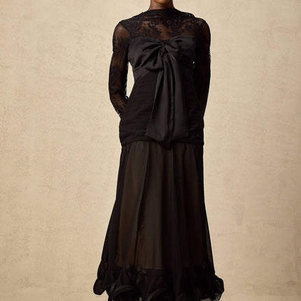 A black midi dress with floral lace panels and sheer details named Amelie