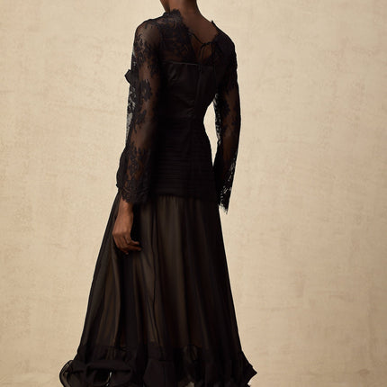 A black midi dress with floral lace panels and sheer details named Amelie