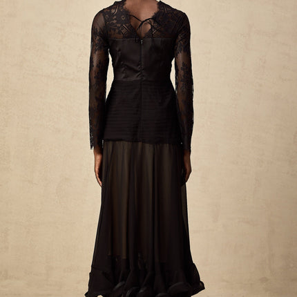 A black midi dress with floral lace panels named Amelie featuring a fitted silhouette and delicate floral patterns throughout