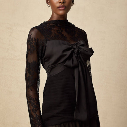 A black midi dress with floral lace panels named Amelie featuring a fitted silhouette and elegant design