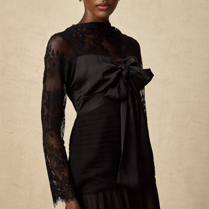 A black midi dress with floral lace panels named Amelie