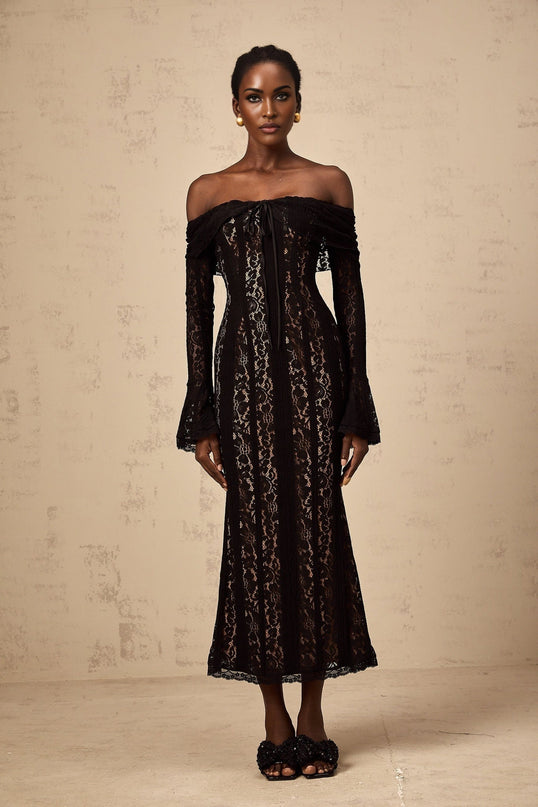 A black midi dress with floral lace pattern and flared cuffs named Emeline