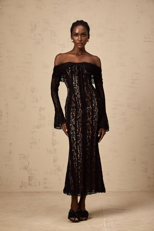A black midi dress with floral lace pattern and flared cuffs named Emeline