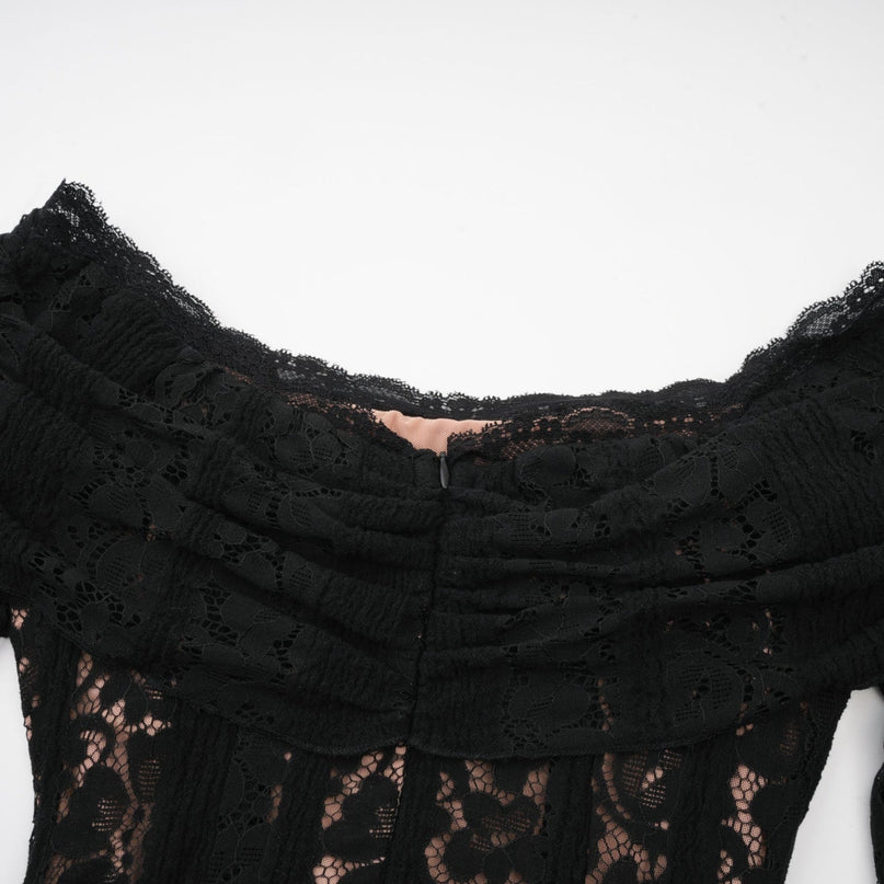 A black midi dress with floral lace pattern featuring flared cuffs and a fitted silhouette named Emeline