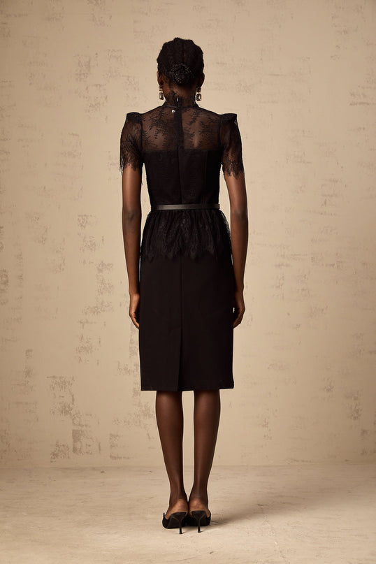 A black midi dress with guipure lace panels and no belt featuring a design inspired by Therese