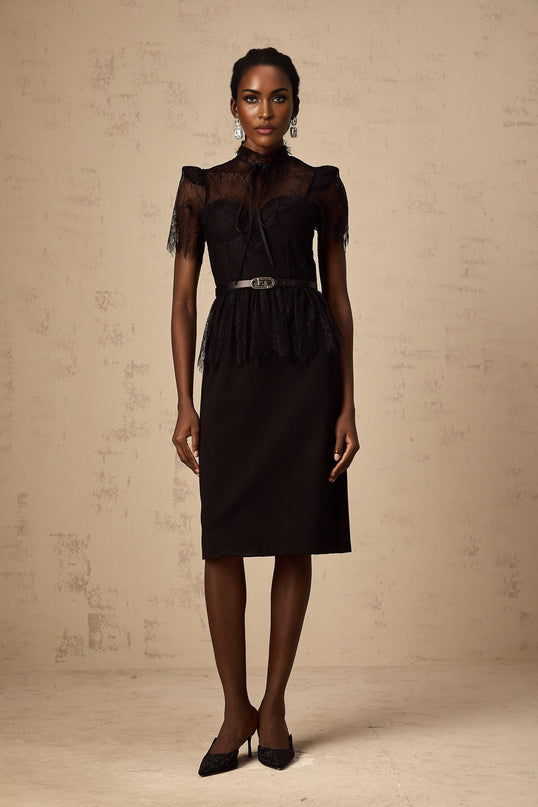 A black midi dress with guipure lace panels featuring a fitted silhouette and sleeveless design without a belt