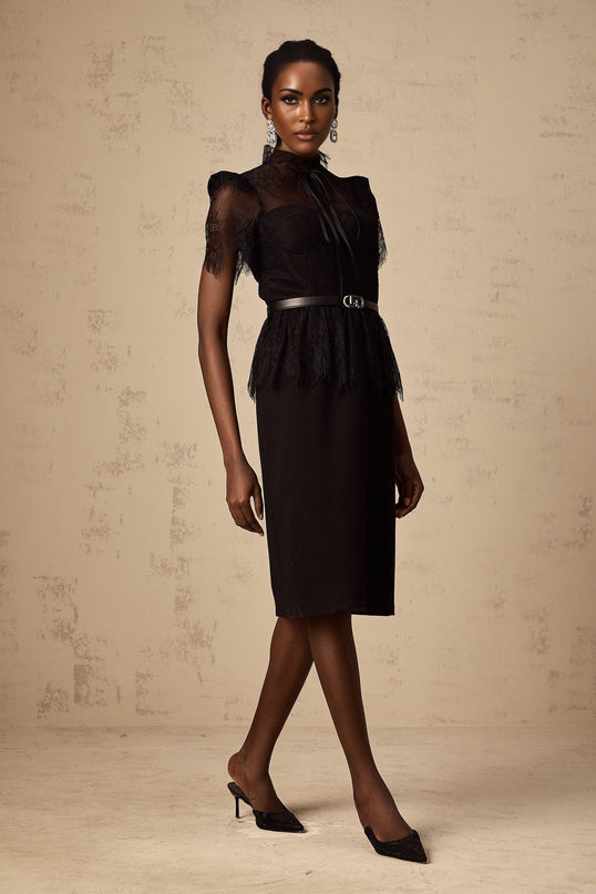 A black midi dress with guipure lace panels featuring a fitted silhouette and sleeveless design without a belt