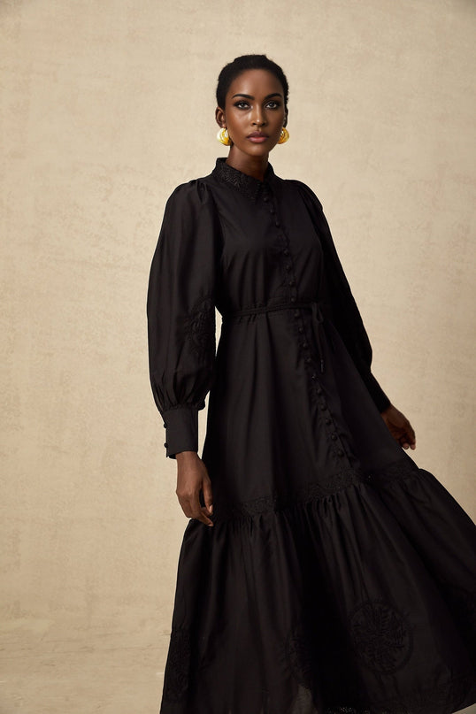 A black midi dress with lace embroidery details named Arcadia