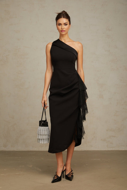A black midi dress with lace panels and an asymmetric hemline featuring a fitted silhouette and delicate detailing