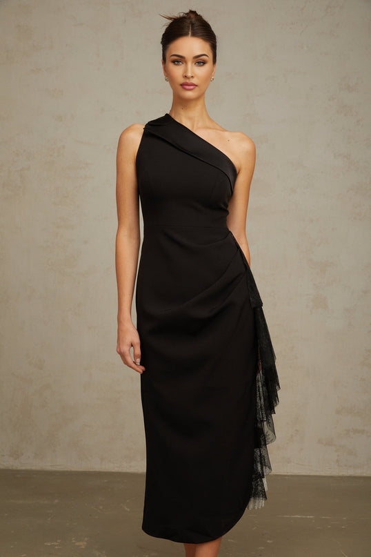 A black midi dress with lace panels and an asymmetric hemline featuring a fitted silhouette and elegant design
