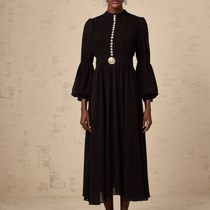 A black midi dress with pleated details and a buttonfront design named Viviane