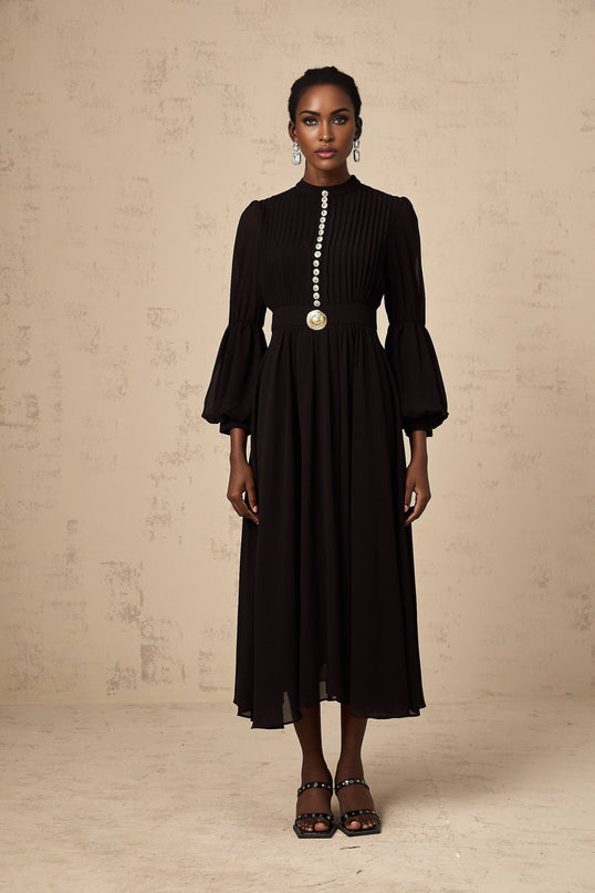A black midi dress with pleated details and a buttonfront design named Viviane
