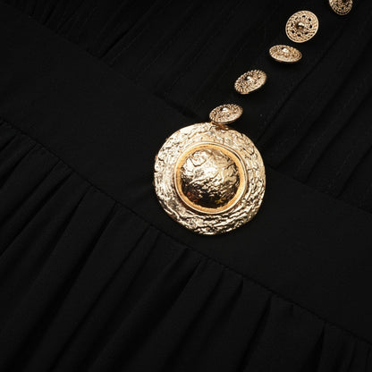 A black midi dress with pleated fabric and buttonfront design featuring long sleeves and a feminine silhouette