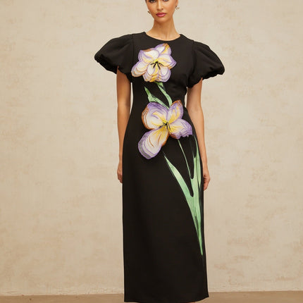 A black midi dress with sequin embellishments and floral embroidery details