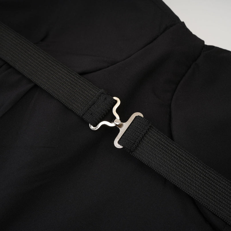 A black mini dress adorned with crystal embellishments featuring a short hemline and likely a fitted silhouette named Emmeline