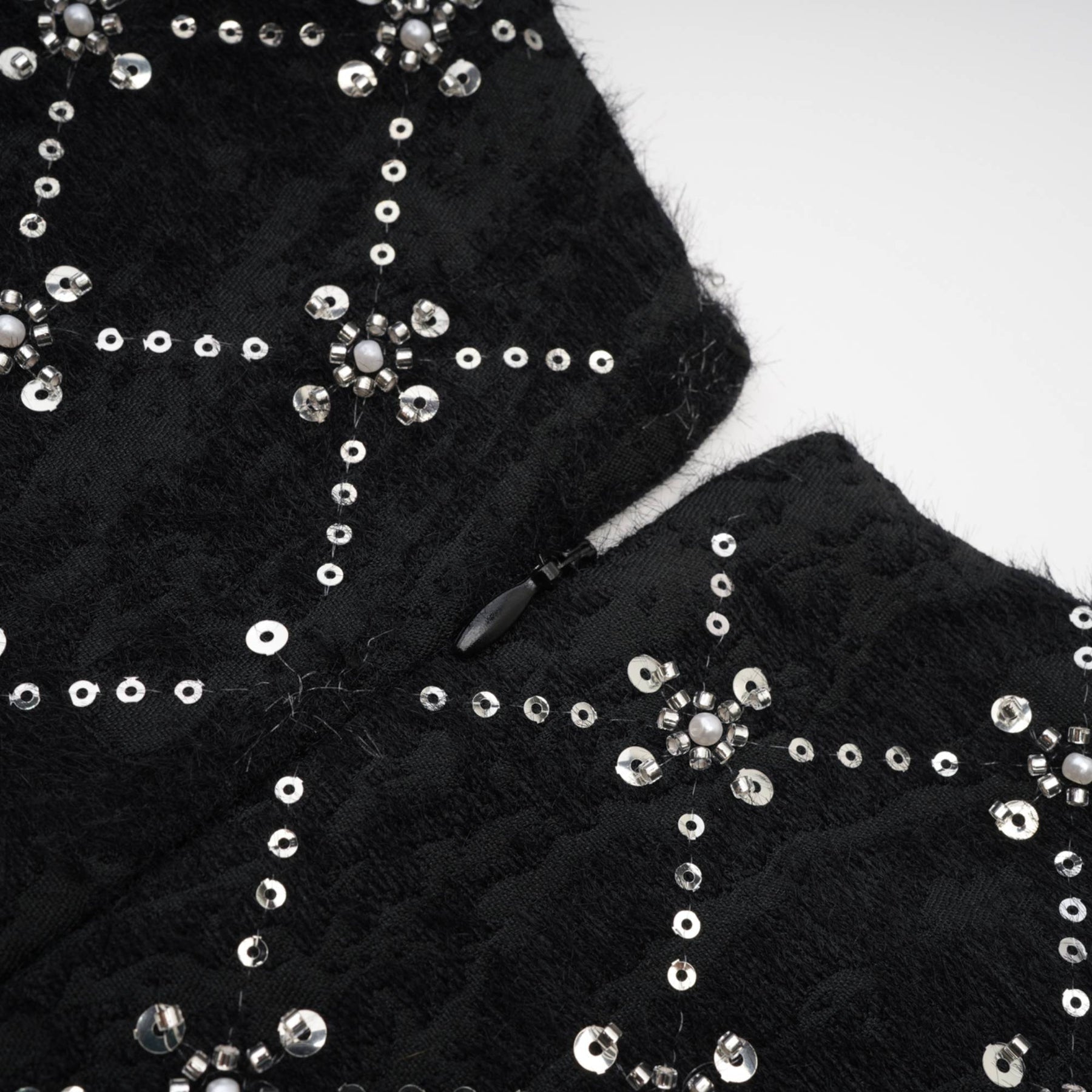 Jet Black sleeveless dress with shiny crystal embellishments and a hidden rear zipper made of 100% highquality polyester