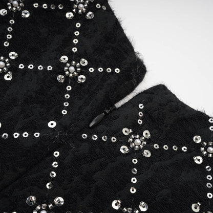 Jet Black sleeveless dress with shiny crystal embellishments and a hidden rear zipper made of 100% highquality polyester