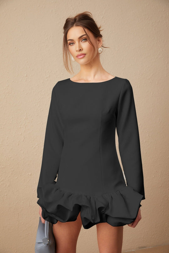 A black mini dress with a bubble skirt silhouette named Elodie featuring a fitted bodice and flared bottom