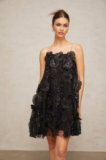 A black mini dress with a floral pattern and crystal embellishments called Suzette